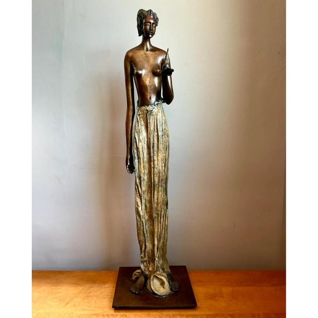 Commanding and serene, this monumental vintage bronze sculpture captures an extraordinary synthesis of stylized modernism...