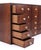 1960s Mid Century rosewood wall cabinet with twenty drawers in a four across, five down arrangement. There are inset...