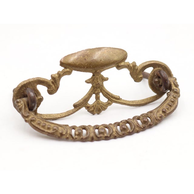 Victorian style drawer pulls made of brass with a patina finish. The original mounting nuts are not included. Good...