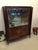 Stunning French Art Deco vitrine or dry bar. Having beautiful mother-of-pearl inlay with gorgeous marquetry. With black...