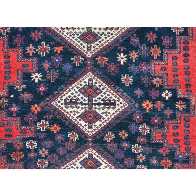 Vintage Persian Mazlaghan rug with a bold geometric pattern woven with three large white diamond medallions amidst a field...