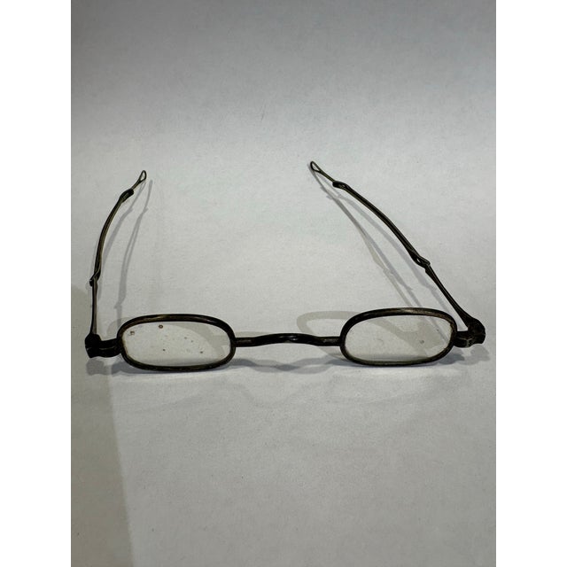 This is a pair of antique metal square shaped spectacles. They are circa the late 19th century. They are a great inclusion...