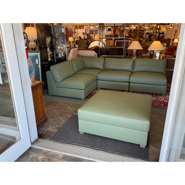 Design Plus Gallery presents a Teal Leather Modular Sofa and Storage Ottoman from Fitzgerald. This sofa is supremely...