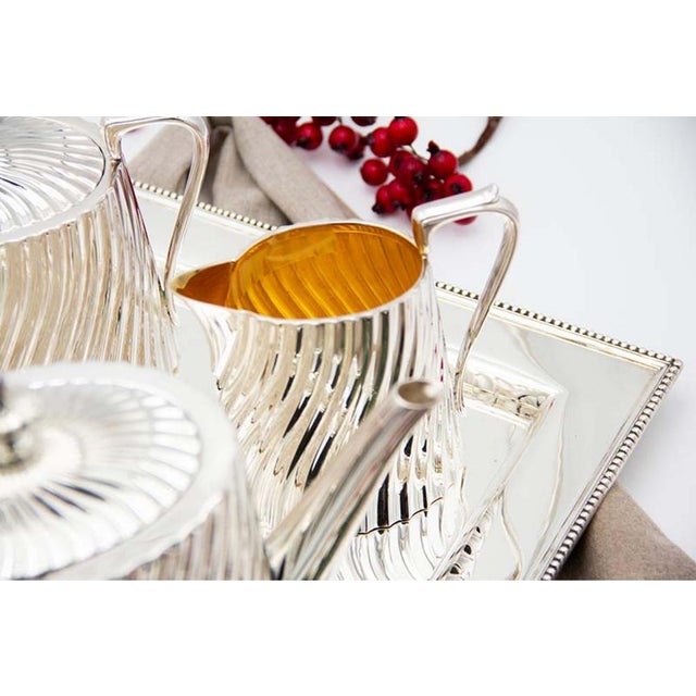 Modernist Silver Tea Service with Tray in Relief, Set of 4, in Good conditions. Designed 1980 to 1989