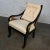Fabulous vintage Neoclassic Revival side chair with a black painted frame, gilt wing accents and off-white upholstery...