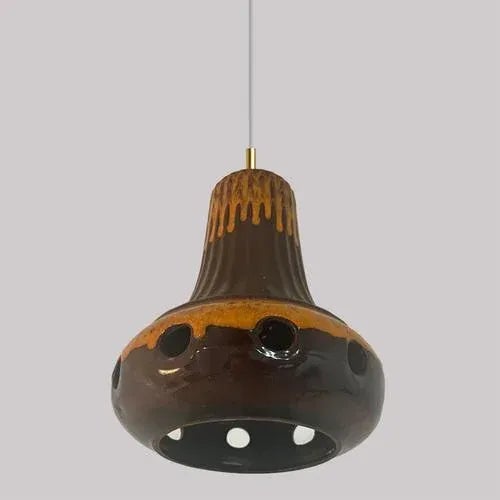 A set of spectacular and stylish ceramic pendant lights made in west-germany around 1970's. The lights are made of orange...