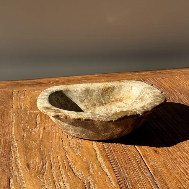 Oval beige petrified wood trinket dish or bowl. Petrified wood is a fossilized wood (from the same family as magnolia)...