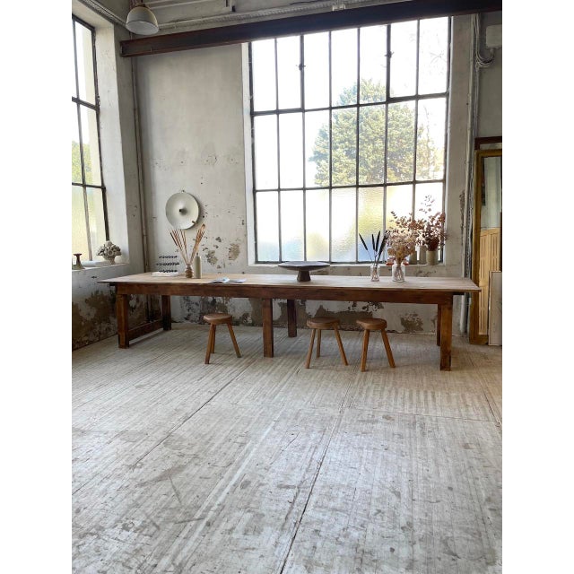 Antique farmhouse-style work table made of pine, measuring 5 meters long. Resting on six legs, including two central legs,...