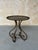 This distinctive vintage Spanish gilt iron drinks or side table, dating to the 1950s, features an intricately shaped hand-...