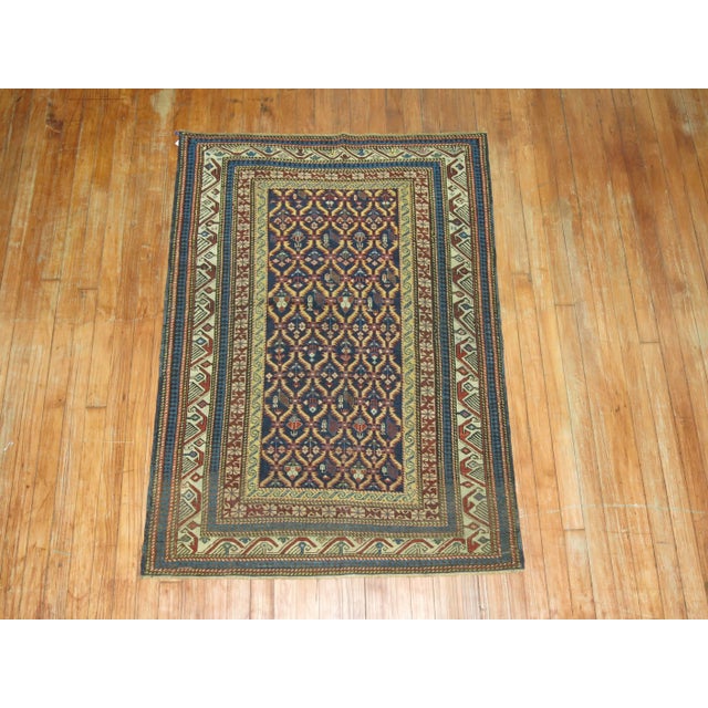 A turn of the 20th century collector level Caucasian Kuba rug. Tight small all-over pattern on a navy ground. The quality...