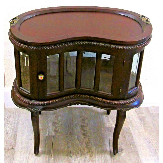 1930's Queen Anne Mahogany Kidney Shaped Beveled Glass Tray Top Drink Cabinet This cabinet is bead trimmed with beautiful...