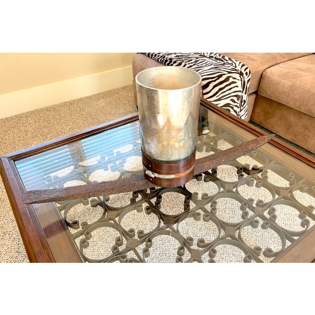 If quirk is what you crave, this might just be for you... This is a mercury glass candle holder with an antique iron...
