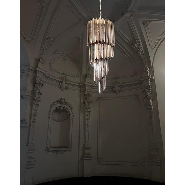 Fantastic Murano chandeliers made by 54 Murano smoked crystal prism (quadriedri) in a chrome metal frame. The shape of...
