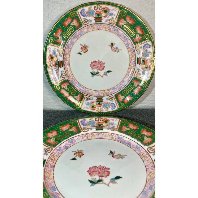Painted in a Chinese exports style with floral motifs, marked 'Ye Olde Hall Potterie,/ Staffordshire, England...', and...
