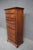 Solid cherry lingerie chest by Kincaid with classic brass hardware. Tall, narrow profile with multiple drawers for...