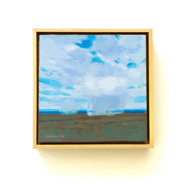 Distant Rains captures a serene landscape where soft, billowing clouds dominate the sky, suggesting an impending downpour....