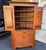 Fine antique American Federal Period cherry corner cupboard with blind doors. Some of the stationary shelves to the upper...