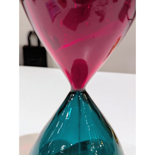 Hand-blown Italian glass hourglass in the Venini Clessidra tradition, featuring precise incalmo construction and bold...