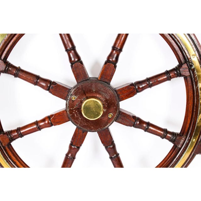 This is an elegant and large antique Victorian teak and brass set ships wheel, circa 1880 in date. This splendid nautical...