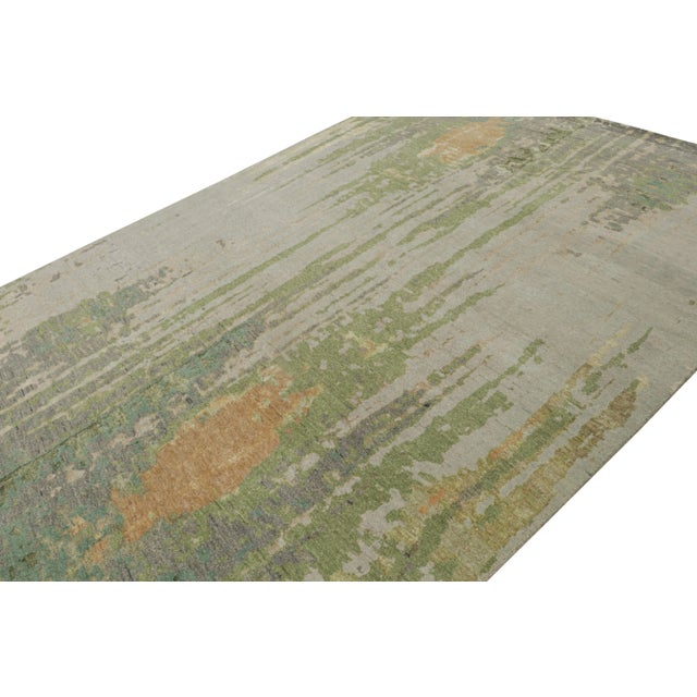 Hand-knotted in wool and silk, this 9x12 modern abstract rug is a work of multicolor contemporary art as much as an art...