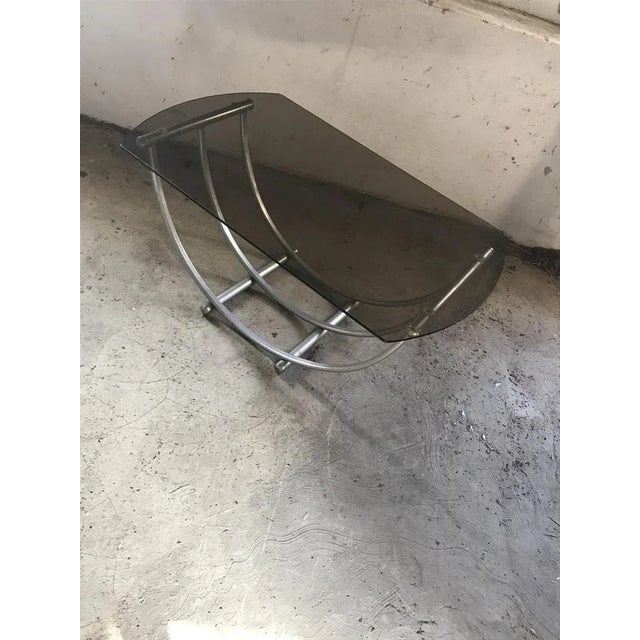 Condition: Good, wear consistent with age and use Table size :114x65 Italian Smoked Glass Coffee Table, 1970s