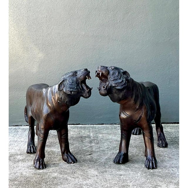 This commanding pair of vintage bronze tiger sculptures showcases exceptional sculptural artistry, each animal captured...