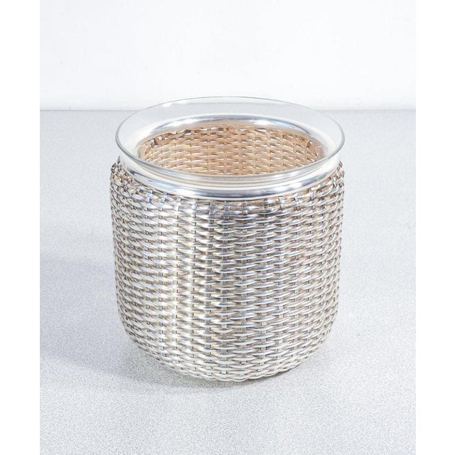 Two baskets, a wine cooler, and a bottle holder, designed by lino sabattini for argenteria sabattini in silver-plated...