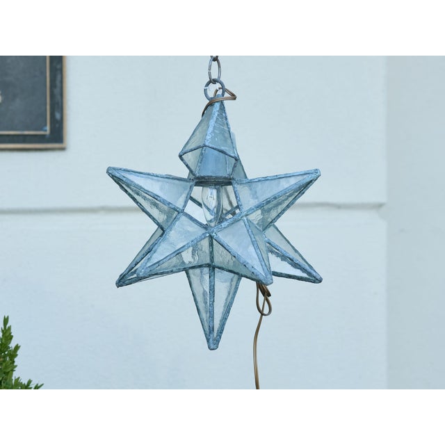 A French Midcentury metal star light fixture with frosted glass panels surrounding a central socket, rewired for the USA....
