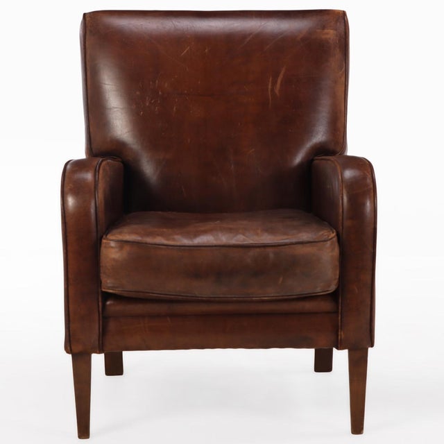 This pair of warm chocolate brown chairs is in very good condition and sits well with squared crests, slightly rolled arms...