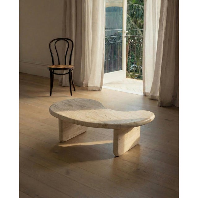 Crafted from a single material, this coffee table features a 4 cm thick top with a soft bullnose edge, supported by two...