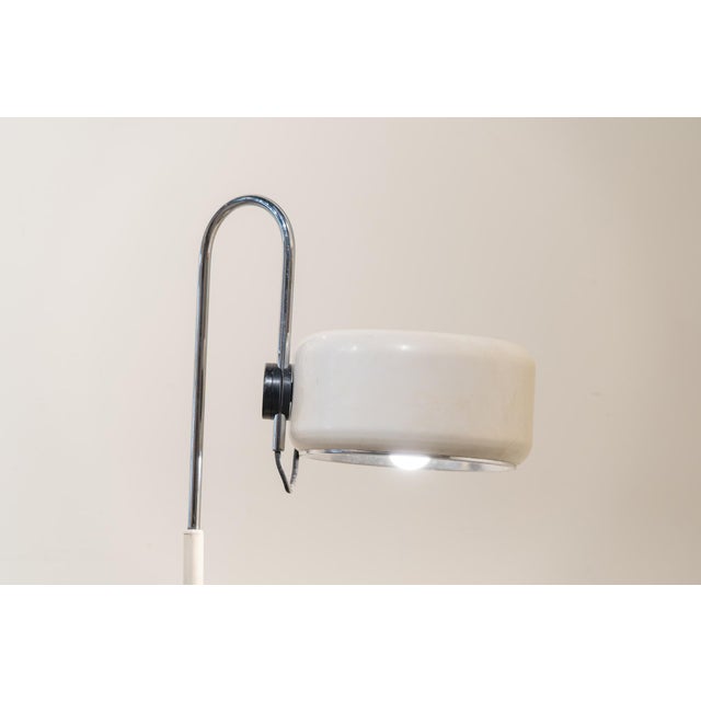 A 1960s-70s Space Age style floor lamp, reminiscent of models from the Netherlands. Its structure comprises a heavy,...