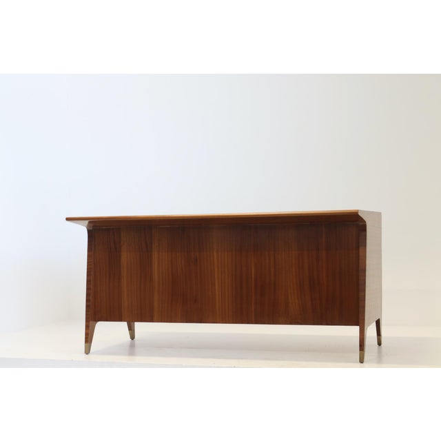 Gio Ponti (1891-1979) Desk in wood, brass, and enameled glass. Model made around 1950. Note: This model was made for the...