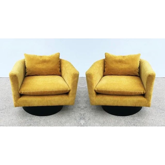 Handsome pair of very unusual swivel chairs designed by Milo Baughman, circa 1960s. One of the leading modern furniture...