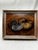 This silver finish framed vintage original oil painting features two beautifully rendered nautilus shells arranged in a...