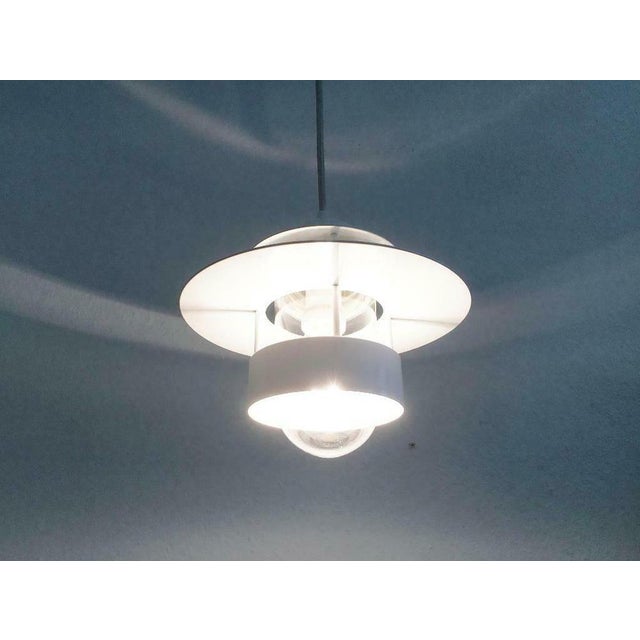 Another Poulsen classic, the Albertslund in the version as a pendant lamp. The lamp body shows the characteristic rings of...