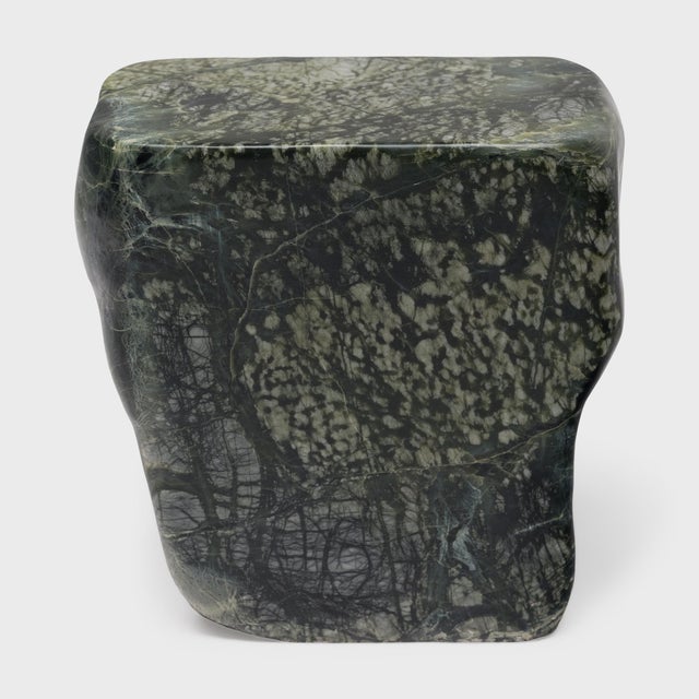 This low stone table is shaped from a captivating material known as greenery stone, named for its naturally occurring...