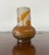 Émile Gallé (1846 - 1904) Small glass vase with color-layered cameo work. Phytomorphic decoration, depicting leaves and...