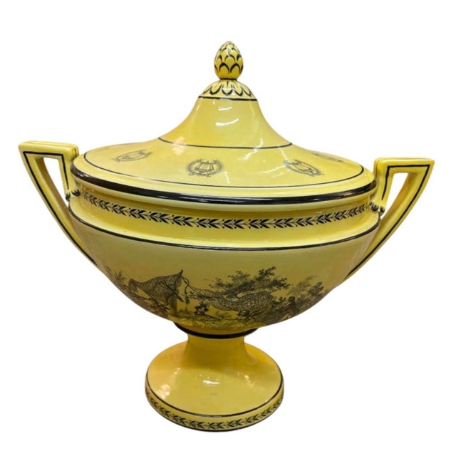 This striking vintage ceramic lidded urn showcases a vibrant yellow glaze contrasted with intricate black transfer-printed...