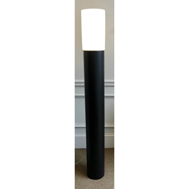 Stylish Arteriors Modern Dominique Torchiere Floor Lamp Pair, black metal base with a frosted glass shade, showroom floor...