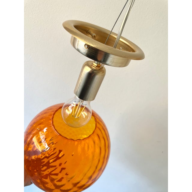 A stunning vintage murano glass chandelier from the 1980s, mouth-blown using the ancient murano technique of baloton. It...