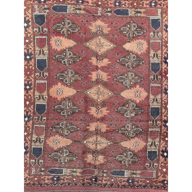 Pretty late 20th century Turkmen Afghan rug with beautiful decorative design and nice colours with a red brown field,...
