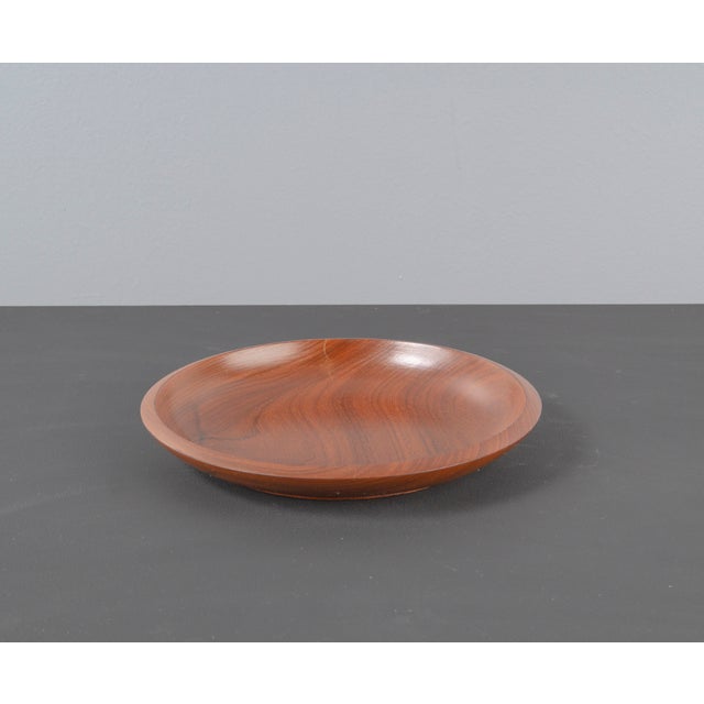 Teak bowl from the 1970s. round teak bowl, very light and already flat with a thick rim.