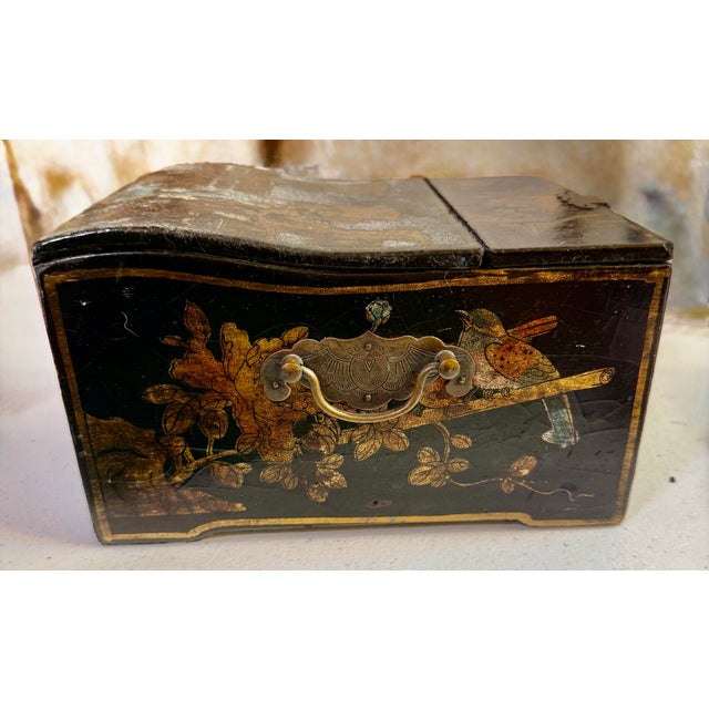 This is a traditional Chinese jewelry and vanity box, featuring a black lacquer finish with hand painted gold detailing...