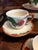 This Franciscan Apple Tea Cup & Saucer Set from England features a charming hand-painted apple pattern on glossy...