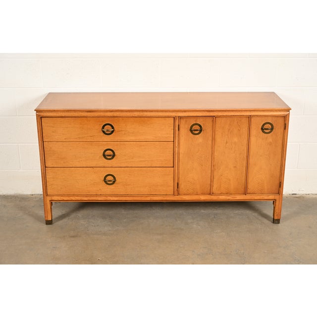 A sleek and stylish mid-century modern Hollywood Regency dresser, sideboard, credenza, or bar cabinet By Century Furniture...