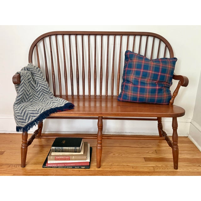 Traditional hardwood Windsor-style bench, based on a classic Pennsylvanian Dutch design and finished medium cherry tone....