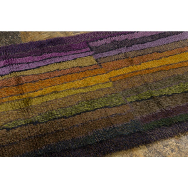 Hand-knotted in wool and originating circa 1950-1959, this 4x7 vintage Swedish Rya rug joins Rug & Kilim’s Scandinavian...