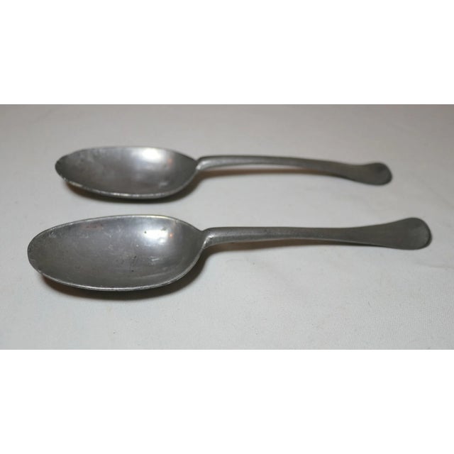 Up for sale is a rare pair of antique 18th century Dutch pewter spoons. They're made of thick pewter and have acquired a...