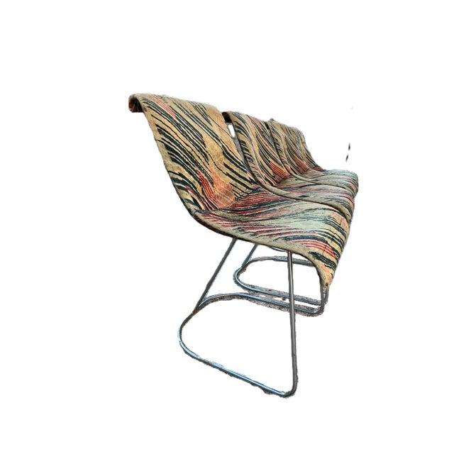 Four vintage chromed metal chairs with geometric pattern fabric upholstery with geometric pattern fabric upholstery...