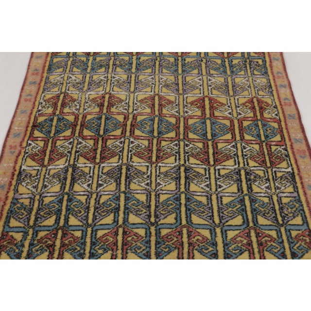 Hand-knotted in wool, this 4x6 vintage Turkish rug pair, dating to circa 1960–1970, features a striking geometric...